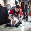 Boy on ground playing with robots