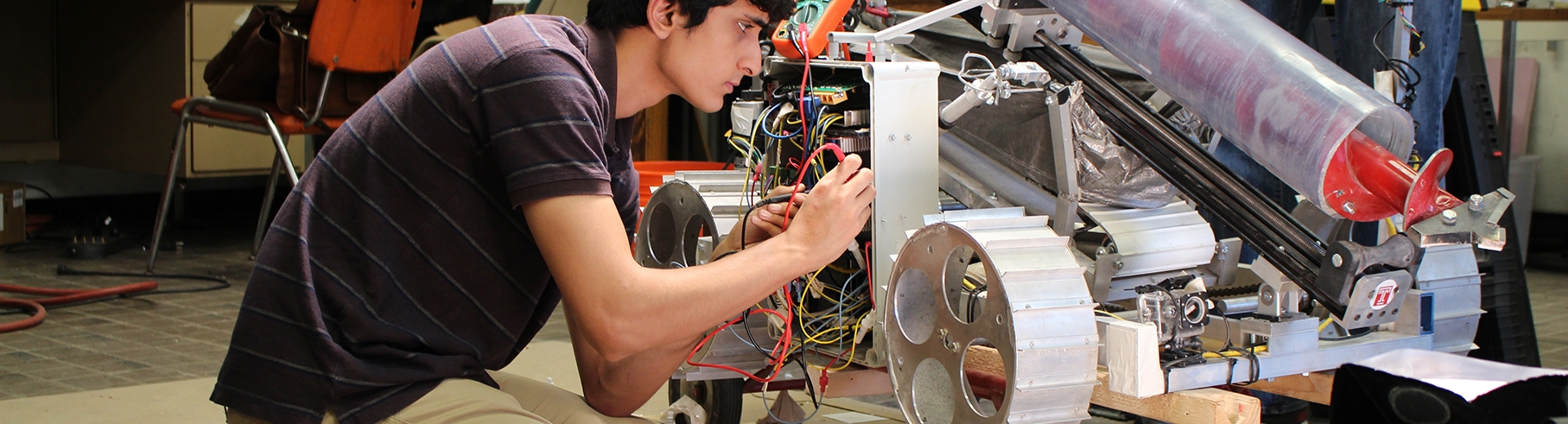 Undergraduate engineering student working on rover